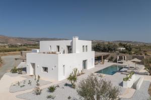 an image of a white house with a swimming pool at Villa Bema - Quietness and Beach access in Molos Parou