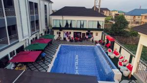 an overhead view of a swimming pool on a building at Pretelia Hotel in Warri