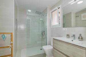 a bathroom with a shower and a toilet and a sink at "The Chill Pad In Cotobro A Boutique Style Studio Where Chillin Is Easy" in Almuñécar +50 photos