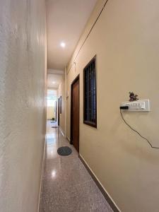 a corridor of a building with a hallway at STAR Residency - G in Pondicherry