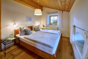 a bedroom with a large bed in a room at Köllhof in Höslwang