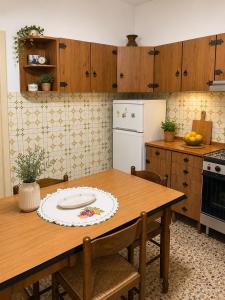 a kitchen with a table with a plate on it at Alba Holiday in Vallecorsa