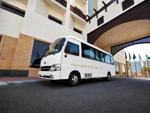 a white van parked in front of a building at فندق تيلا TeeLA HoTeL in Medina +21 photos