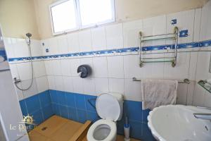 a bathroom with a toilet and a sink at Le Port Hotel in Fort Dauphin +57 photos