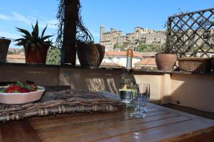 a bottle of wine sitting on a table with a glass at La terrazza di Andrea in Bolsena