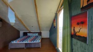 a bedroom with a bed in a room with a window at I love Amboseli in Kimana +29 photos