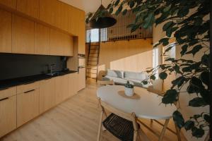 a living room with a table and a couch at SVENCELE DUNES Marių g 31-1 in Svencelė