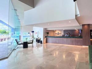 a lobby with a bar in a building at Grand Cantalagua Hotel Morelia, BW Signature Collection in Morelia +161 photos
