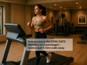 a woman running on a treadmill in a gym at Numa Copenhagen Nørrebro in Copenhagen