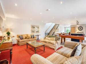 a living room with couches and a pool table at Homewood - Uk36205 in Fordingbridge