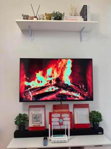 a flat screen tv hanging on a wall at Arezzo Place in Davao City