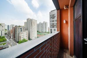 a balcony with a view of a city at Benikea Hotel Kakao in Seoul