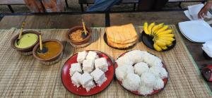 a bunch of different types of food on plates at Sri Craft Algama in Uduwaka +34 photos