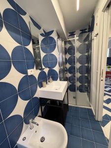 a bathroom with a sink and a shower at Bordo piazza in Vasto +17 photos