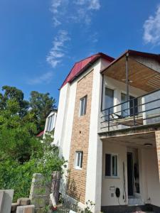 an old house with a red roof at emplus in Batumi