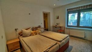 a bedroom with a bed and a window at Alte Posthalterei in Stolberg +41 photos