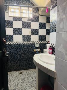 a bathroom with a sink and a toilet at Taman Darul Salam Homestay Pasir Puteh in Pasir Puteh +30 photos