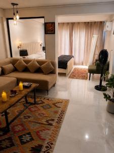 a living room with a couch and a bed at Lamhay Private lodges in Skardu