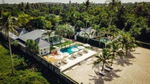 an aerial view of a house with a swimming pool at Bann Sunset Cove Krabi I A Hidden Luxury Escape on Had Yao Beach in Krabi