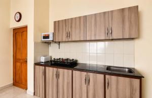 a kitchen with a sink and a counter top at Harmony Vista in Calangute