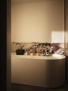a bathroom with a sink and a mirror at The Shepherd Mayfair in London