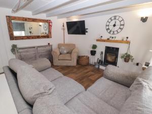 a living room with two couches and a fireplace at 41 St James Street in Narberth