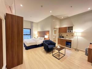 a hotel room with a bed and a chair at فندق هوتيلتن HotelTen in Riyadh +26 photos
