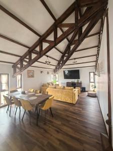 a large living room with a table and a couch at Къща за гости Старлес in Malko Tŭrnovo