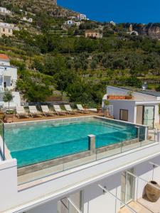 a swimming pool on the roof of a house at Il Tipografo di Amalfi A Family Museum Hotel in Amalfi