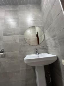 a bathroom with a sink and a mirror on the wall at Hostel Velvet Vouge in Yerevan +70 photos