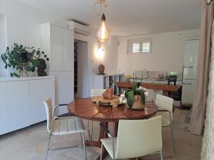 a kitchen and dining room with a table and chairs at Bed and Breakfast with a View & Pool Bastide de Marie Grasse in Grasse +40 photos