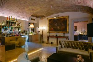 a living room with a couch and a bar at Hotel Villa San Pio in Rome