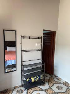 a empty wine rack in a room with a mirror at El Nido in Samaipata