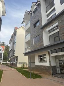 a row of apartment buildings on a street at Appartement - centre ville Ifrane in Ifrane
