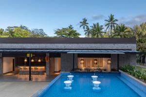 a villa with a swimming pool and a resort at Avani Plus Barbarons Seychelles Resort in Grand'Anse