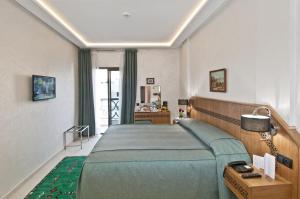 Voodi või voodid majutusasutuse Hôtel l'escale toas