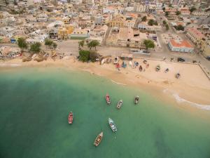 an aerial view of a beach with boats in the water at Oasis White Hotel in Sal Rei