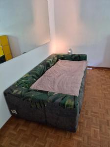 a couch sitting in the corner of a room at YveSkinYoga in Zurich