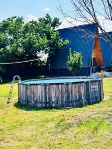 a small pool in a yard next to a building at Kakhaberi Cottages in Stantsiya Batumi-Passazhirskaya +24 photos