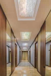 a corridor of a building with a ceiling with skylights at Hotel Saranda Butrinti, Affiliated by Meliá in Sarandë