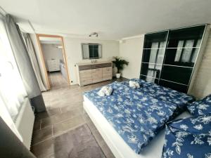 a bedroom with a bed with two stuffed animals on it at Chalet Bellevue Beautiful Waterfall view private Garden & free parking in Lauterbrunnen