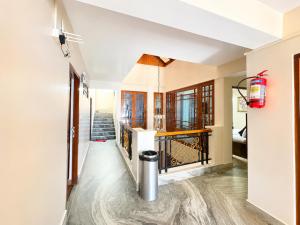 a hallway of a home with a staircase and a hallway at Hotel White Yak Darjeeling in Darjeeling