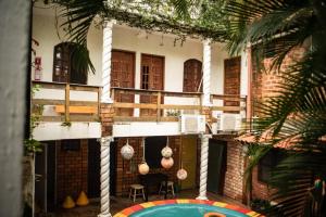 a building with a pool in front of it at Recanto do caja in Porto De Galinhas