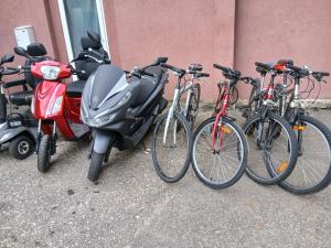 a group of bikes and scooters parked next to a building at Forrent-ee in Pärnu