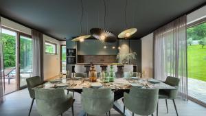 a dining room with a large table and chairs at Magnificent Istria Villa Villa Green Oasis 4 Bedrooms Heated Pool in Labin