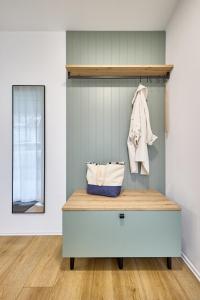 a dressing room with a bed and a mirror at Northside I - Evergreen in Cuxhaven +14 photos