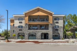an apartment building with a balcony on a street at Holiday Inn Express Fallon by IHG in Fallon
