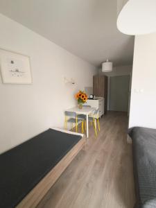 a living room with a table and a dining room at Ludna 27 in Niechorze +69 photos