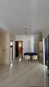 a dining room with a table and two chairs at Résidence Talhaoui in Saïdia