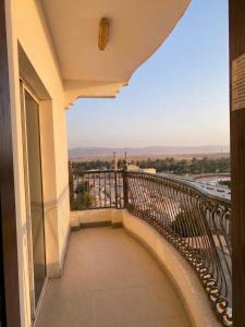 a balcony of a building with a view at Aknan Center Market in Salalah